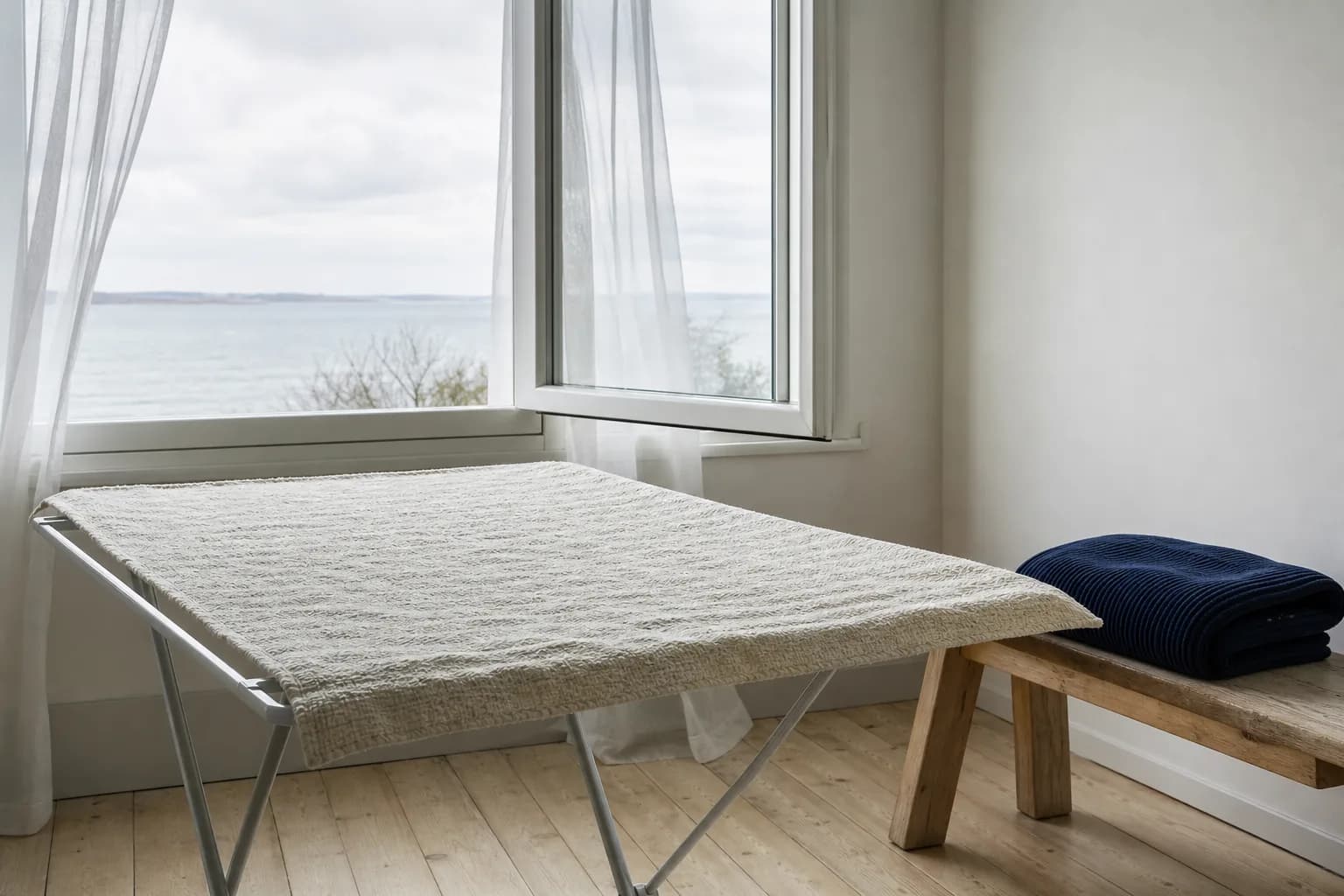 A light blanket laid flat to dry on a clean surface